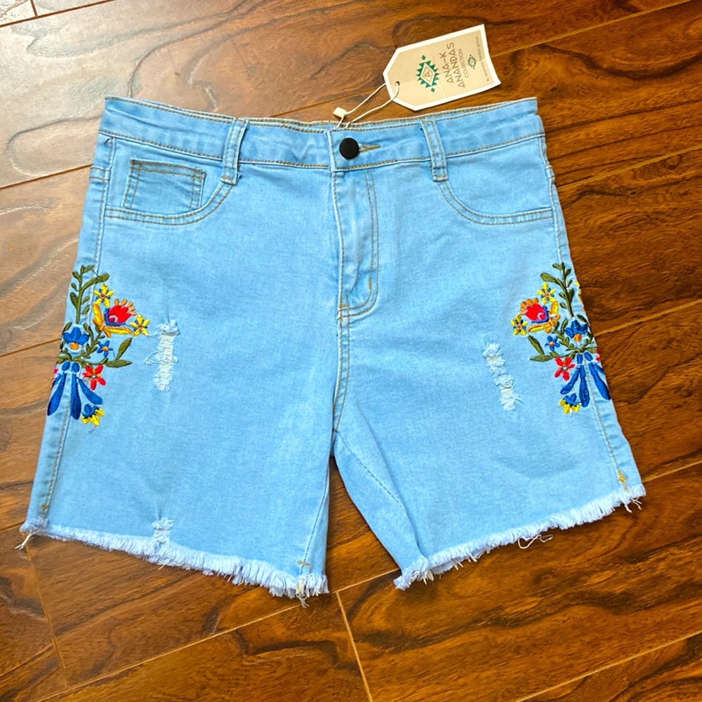 NWT light blue denim cutoffs in size L